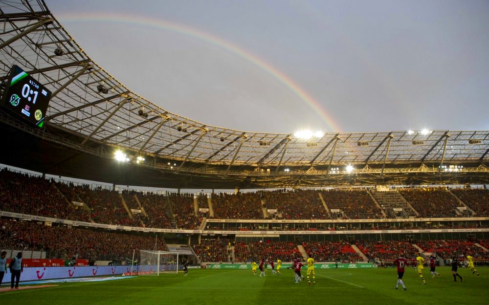 A rainbow is seen above the AWD Arena as Hannover 96 slug it out against Borussia Dortmund
