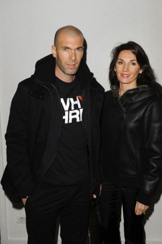 Zinedine Zidane poses with his wife Veronique as they attend the Adidas & Y3 Menswear Autumn - Winter 2010 cocktail presentation in Paris.