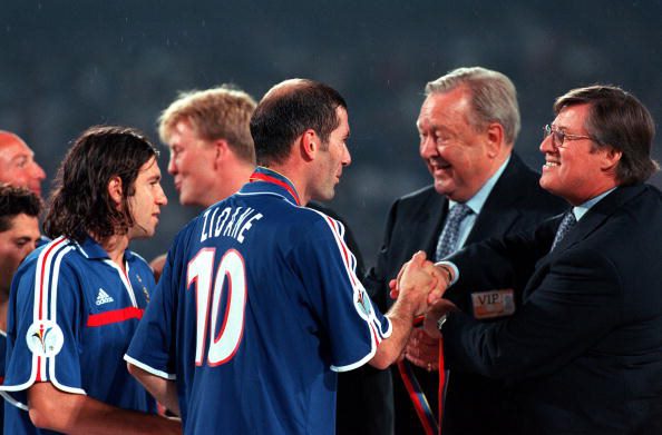 Zinedine Zidane receives his medal and congratulations from UEFA President Lennart Johansson and Chief Executive Officer Gerhard Aigner